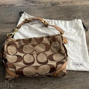 Signature Coach shoulder hobo bag with leather and gold accents